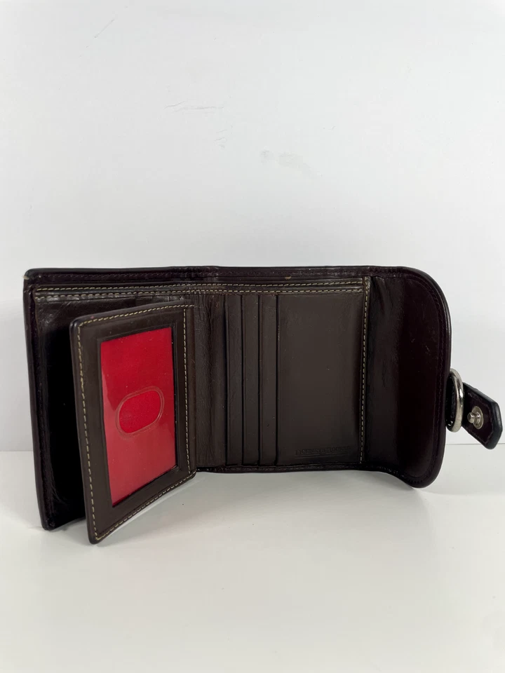 Cartera de cuero marrón Dooney & Bourke con cierre de metal logotipo en relieve - Usada buena Foto 4 de 4