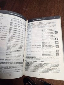 nes game genie with book broken tab