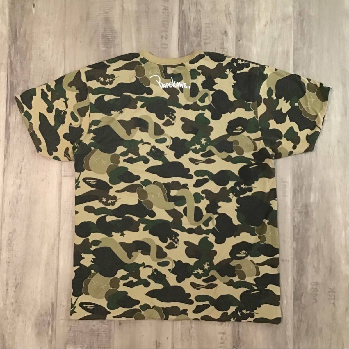 APE BAPE KAWS 1st Camo カレッジロゴ　ロンt tシャツ　s Bape x Kaws 1st Green Camo NYC College Logo Tee White