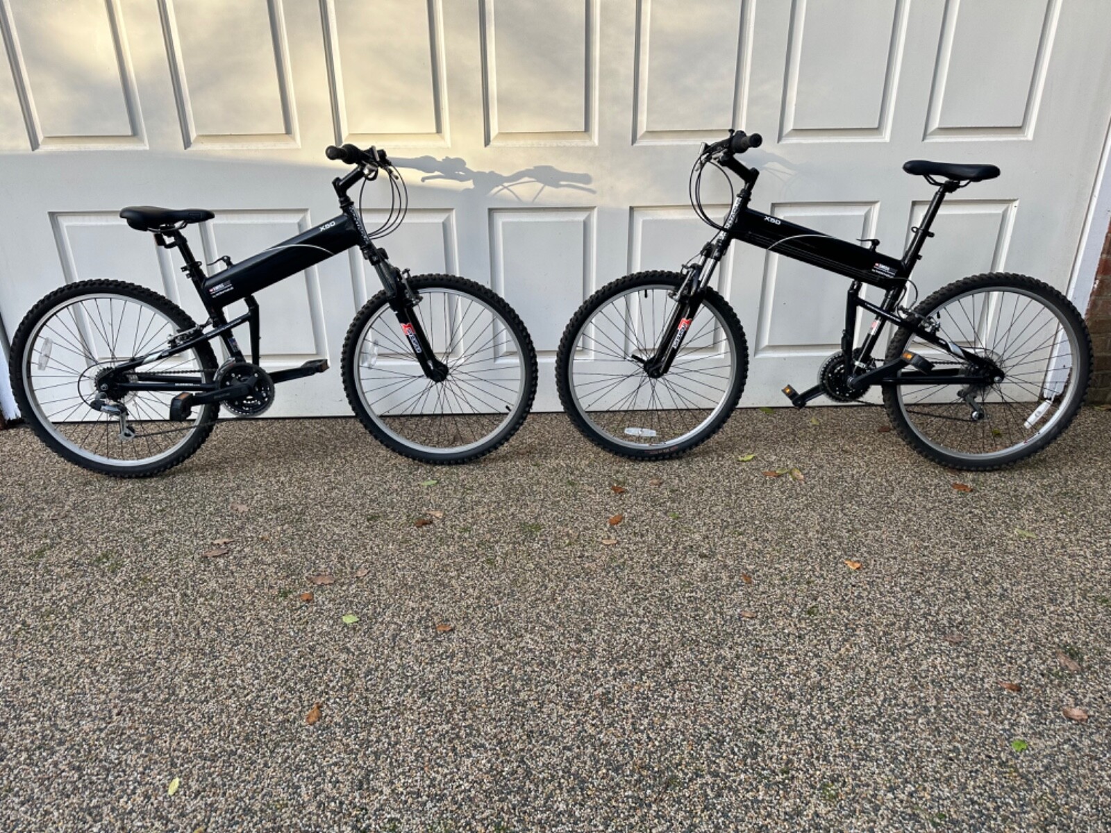 His and hers Montague Folding Mountain Bike + Carry Bags Folding