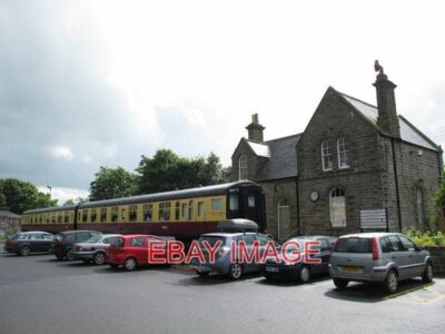 PHOTO  THE 13.27 FROM HEXHAM TO RICCARTON JUNCTION AT BELLINGHAM RAILWAY STATION