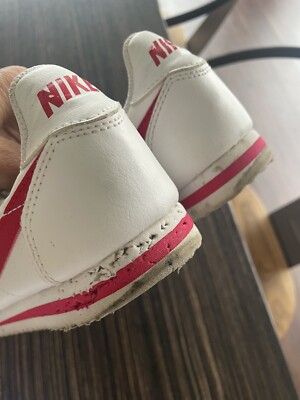 red tick nike trainers