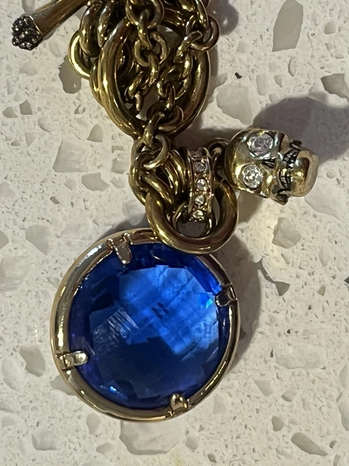 Juicy Couture Goldtone Skull Charm Bracelet With Faux Blue Stone Costume Jewelry - Image 2 of 4