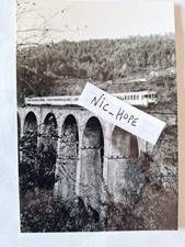 Fotografia Convoglio Passeggeri ALe 803 e rimorchi su Viadotto Ferroviario 