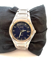 Citizen Eco Drive  Mens  Titanium WR 100 MT Calendar Watch E111-K002141