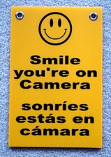 SMILE YOU'RE ON CAMERA  SIGN 8"x12"  w/ Grommets Security Surveillance Spanish