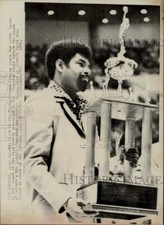1974 Press Photo Detroit Pistons Coach Ray Scott holds coach of the year trophy