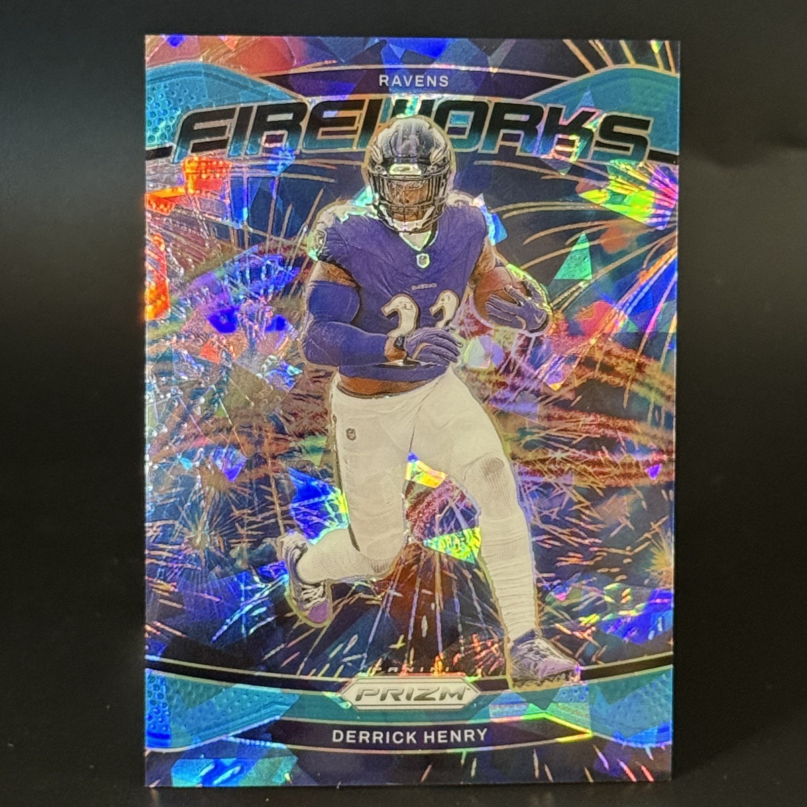 2024 Panini Prizm DERRICK HENRY FIREWORKS BLUE CRACKED ICE /99 Ravens #10