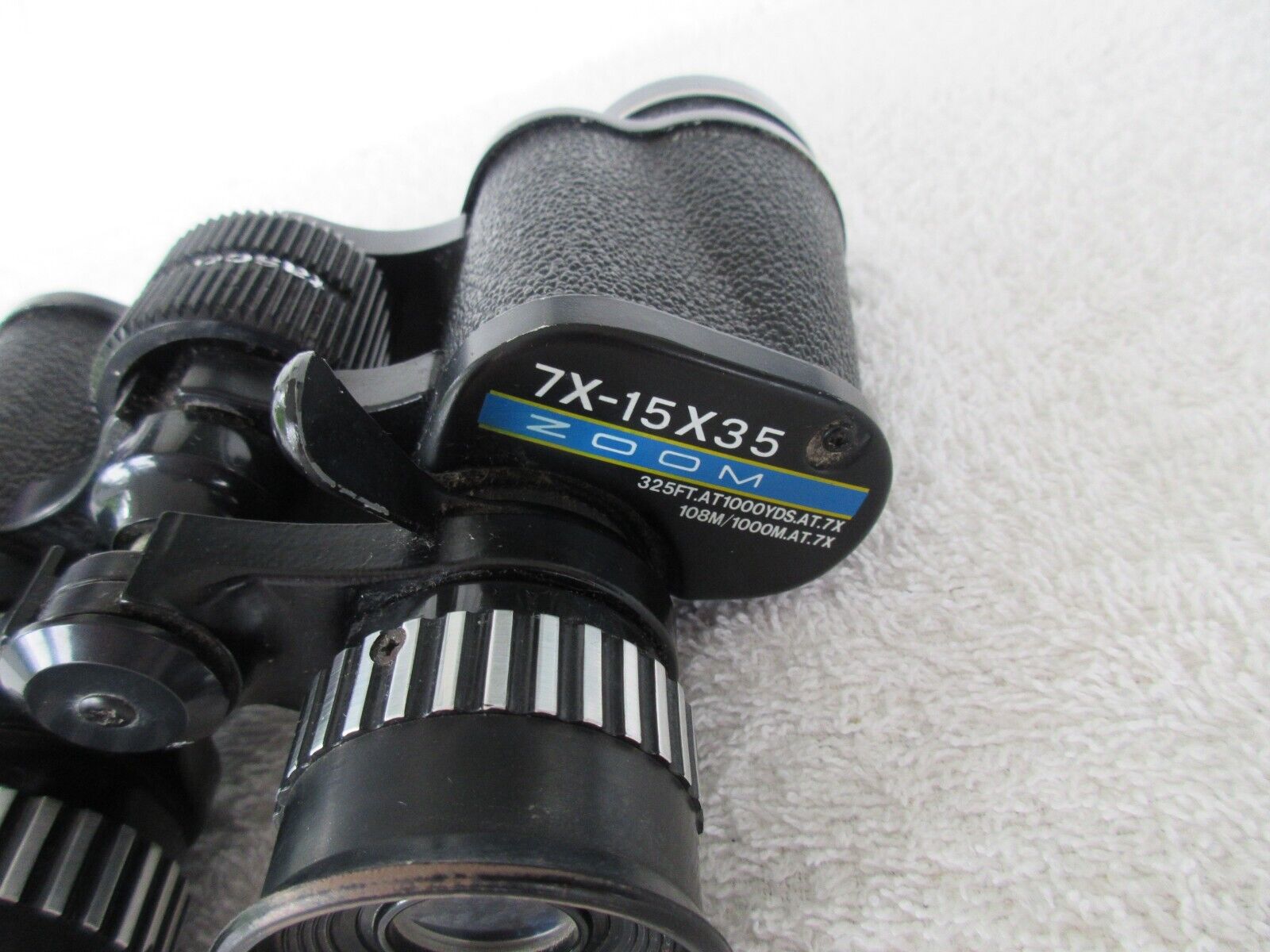 Tasco Zip 1001Z Focus 7X - 15 x 35 Zoom Binoculars 325 feet at 1000 Yards  At 7x