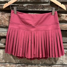 Minifalda plisada con bisagra dorada tenis pickleball frambuesa con pantalones cortos incorporados