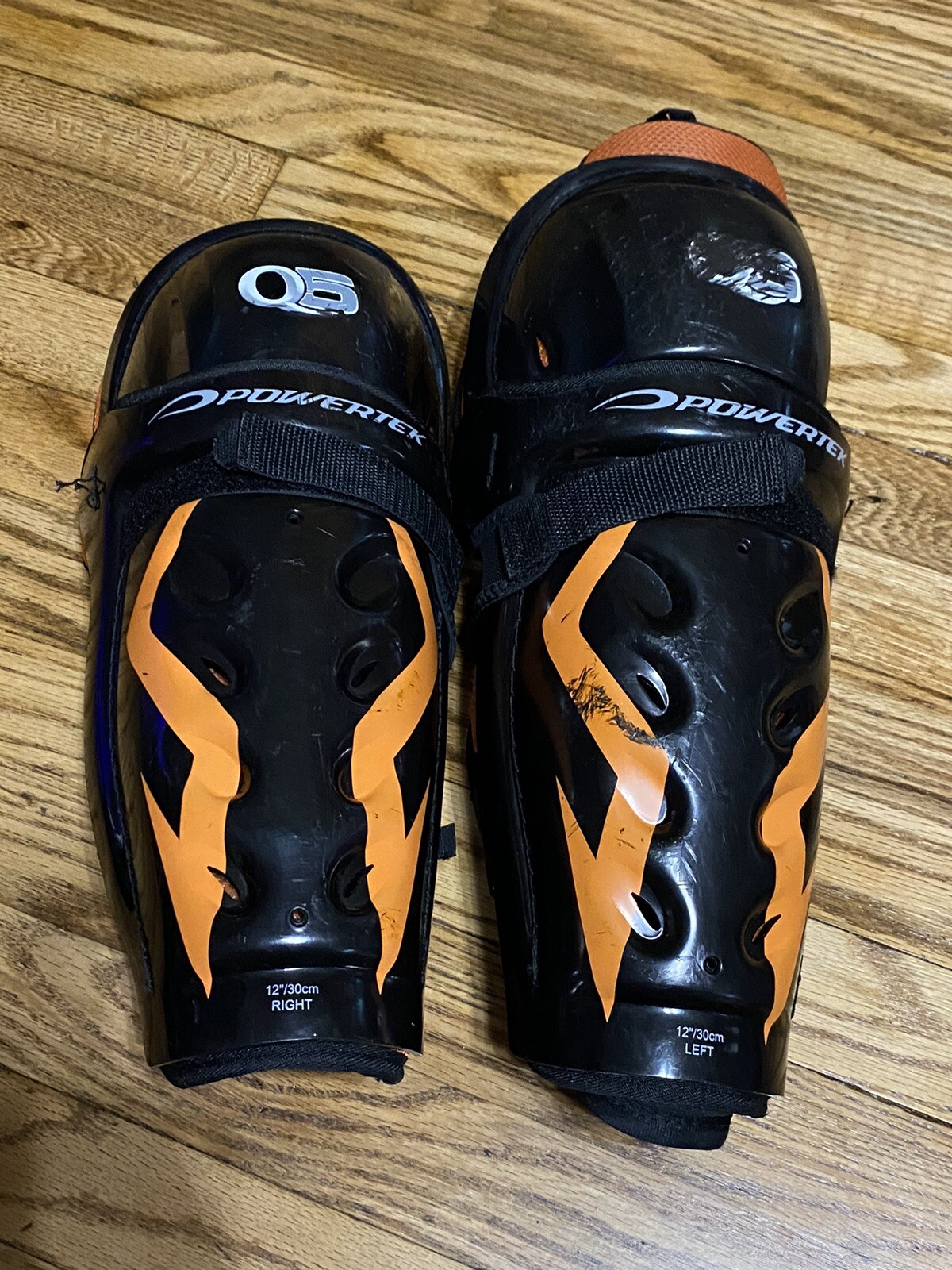 PowerTek Q5 Ice Hockey Jr. 12” Shin Guards Black Orange
