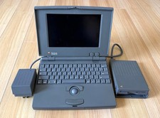Apple PowerBook 100 with external Floppy drive and working AC adapter, Powers up