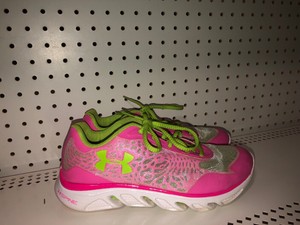 pink and green tennis shoes
