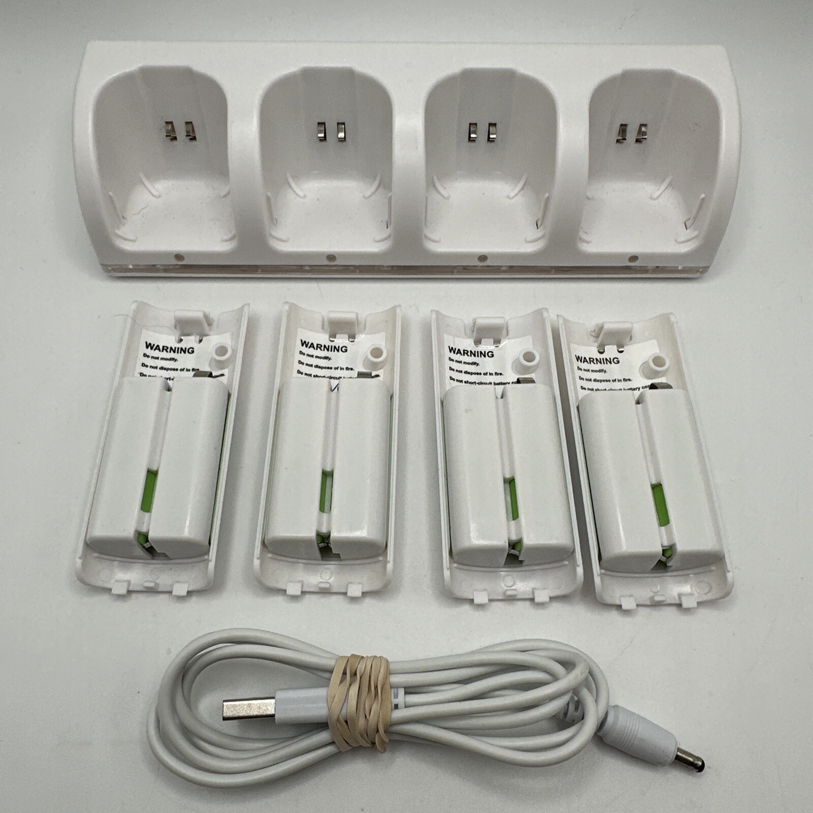 4 Rechargeable Batteries with Charger Dock for Nintendo Wii Remote  -image