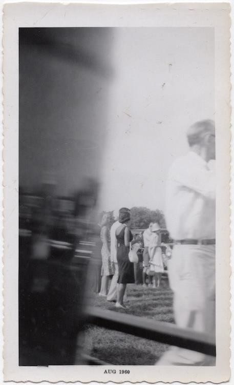 Crowd with reflective surface or photo anomaly, 1960