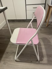 Pink and white folding chair for childs desk