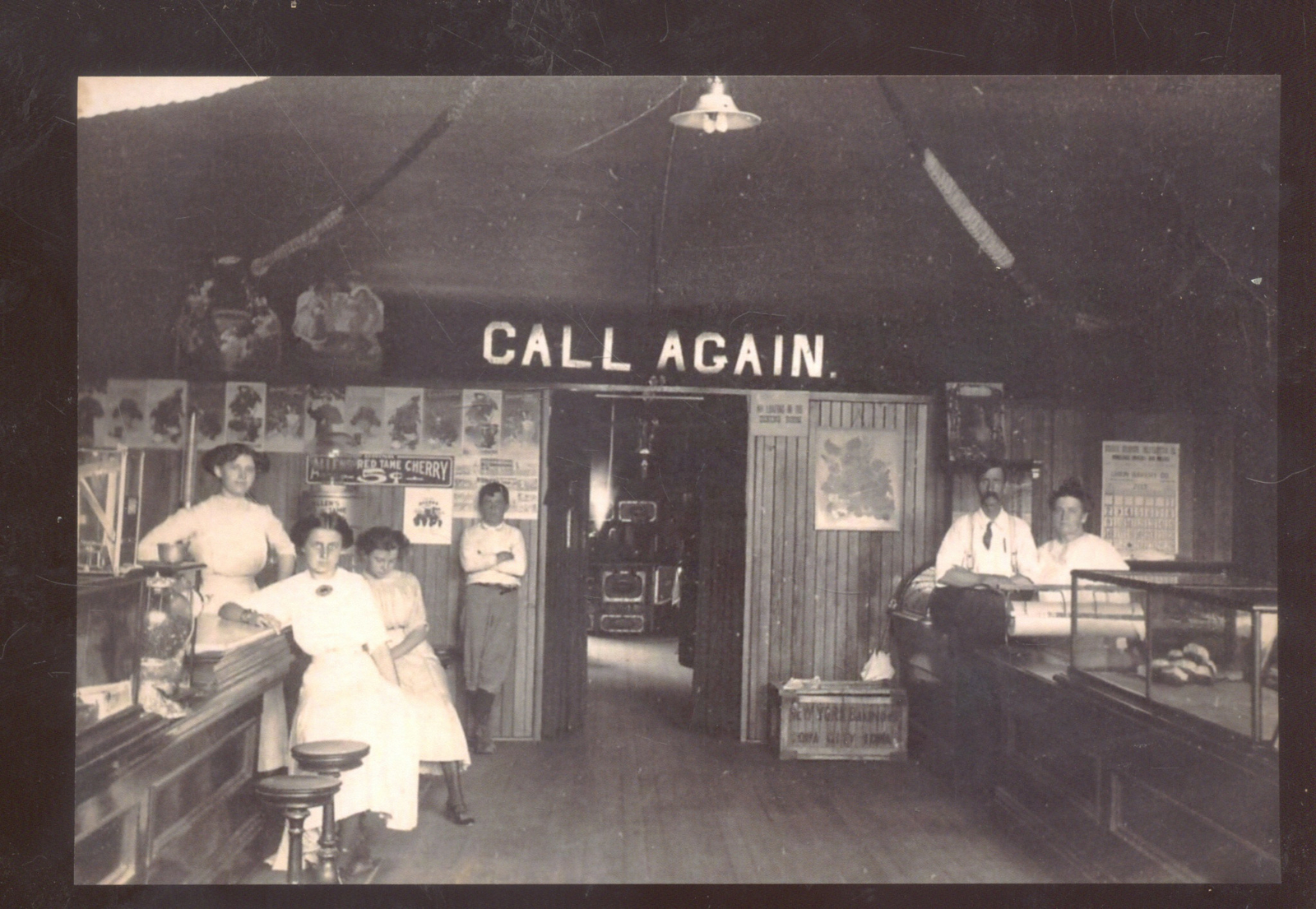 REAL PHOTO IOWA CITY IOWA DRUG STORE INTERIOR ADVERTISING POSTCARD COPY