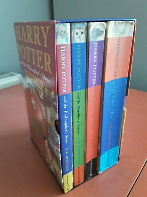 HARRY POTTER 1 - 4 PAPERBACK BOOKS BOXED SET J K ROWLING SLIP CASE USED READ