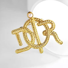 Classic braided letter brooch, 24k gold plated alloy, inlaid with pearls.
