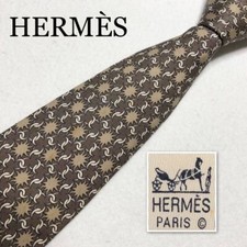 HERMES Tie All over pattern 100 silk Made in France Brown