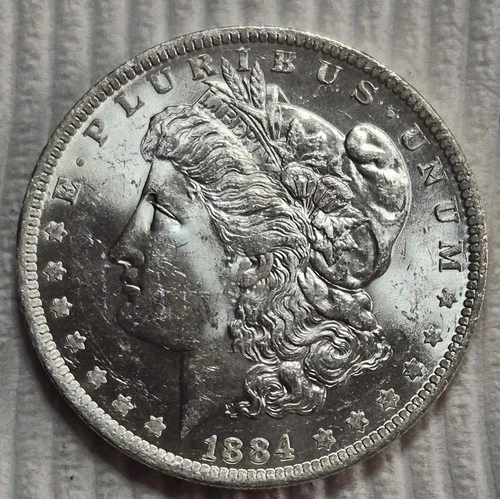 1884 O Morgan Silver Dollar. Estimated Uncirculated 64. Die Cracks. Bright A0791