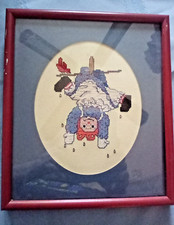VINTAGE framed Raggedy Ann Hanging Upside Down to Dry Framed needlepoint