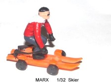 Marx 1/32 scale toy snow skier that rolls.