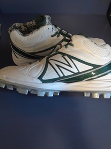white and green new balance cleats