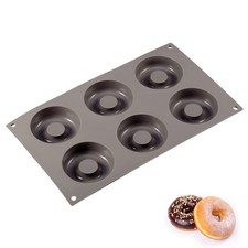 This savarin mold features a circular shape with a central depression, making it