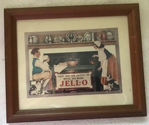 A Framed 'Jello' Print (Reproduction) - Depicts an 1800's Family with Jello!