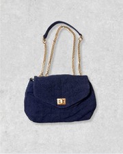 Quilted denim shoulder bag with a gold chain strap