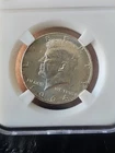 1964 Kennedy Half Dollar, 90% Silver, Average Circulated In A Blank Slab