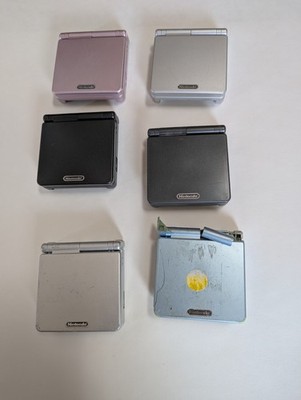lot of 6 gameboy advanced, replacement cases, power cords, extra motherboard...