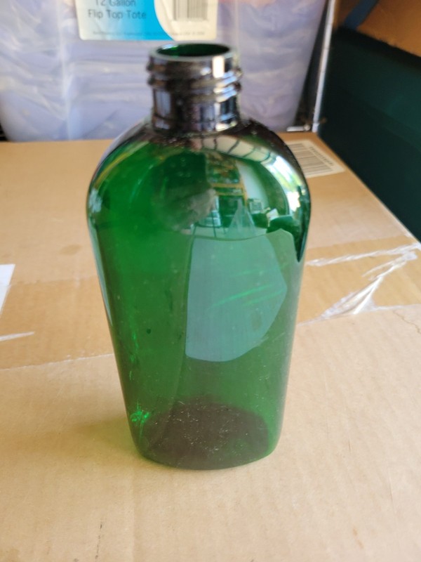 Twenty-eight 8 oz. Green PET Dundee Oval Bottles with White LDPE Flip Spout Cap