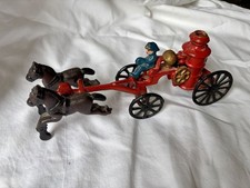 Vintage Cast Iron Horse-Drawn Fire Truck Toy with Firefighter