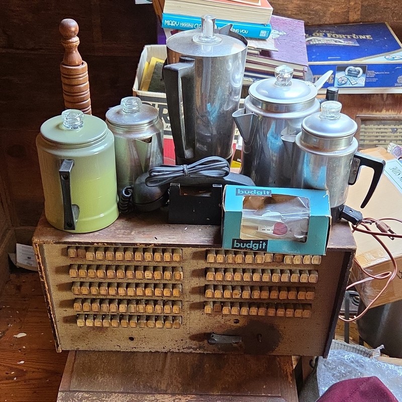 Coffee pots, switchboard and can opener.