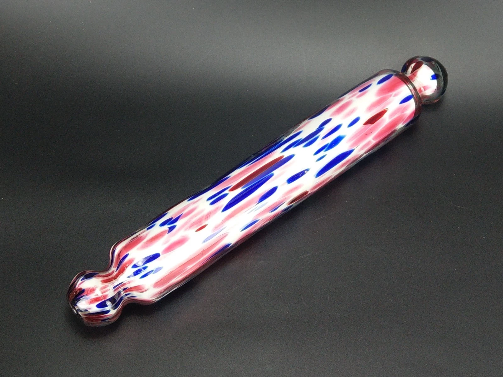 Antique rolling pin blue and pink splatter Nailsea glass plaster filled