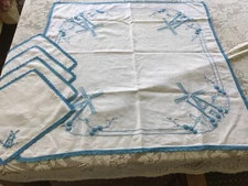 Blue and white linen tablecloth 36 x 34 with 4 embroidered napkins windmill them