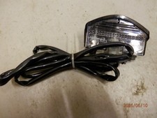 Listing image for Triumph Rocket 111 Rear number plate lamp. Genuine part. Fits 2014 model range.