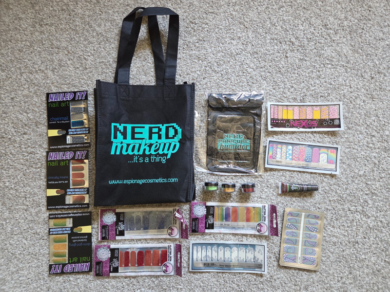 Espionage Cosmetics Lot 10 Nail Wraps 1 Lip Gloss 3 Eye Shadow Humidor and Tote