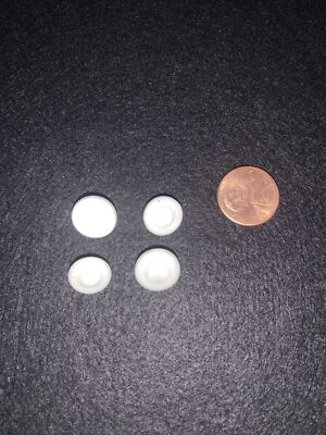 Four Small White China Gaiter Buttons