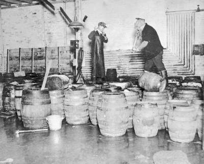 Two Men Destroy Barrels Of Confiscated Alcohol By Taking Axes To  - Old Photo