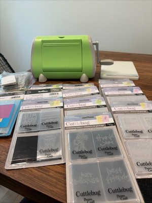 Cuttlebug Machine with plates,  embossing folders, Spacers, Borders, Cutting Pad