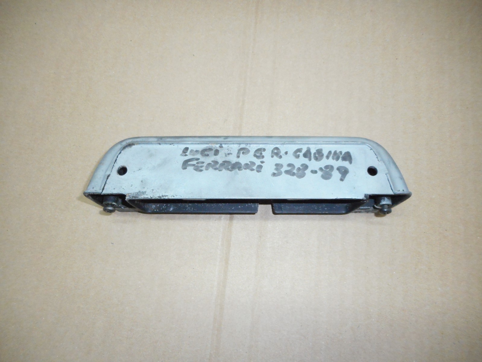 Ferrari 328 interior dome light assembly.