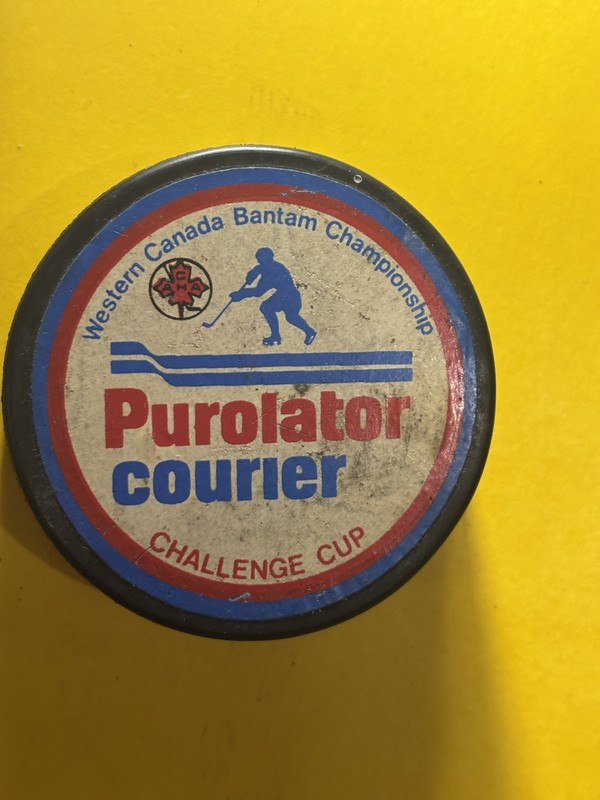 OLD VINTAGE HOCKEY PUCK - PUROLATOR COURIER CHALLENGE CUP - BLANK BACK