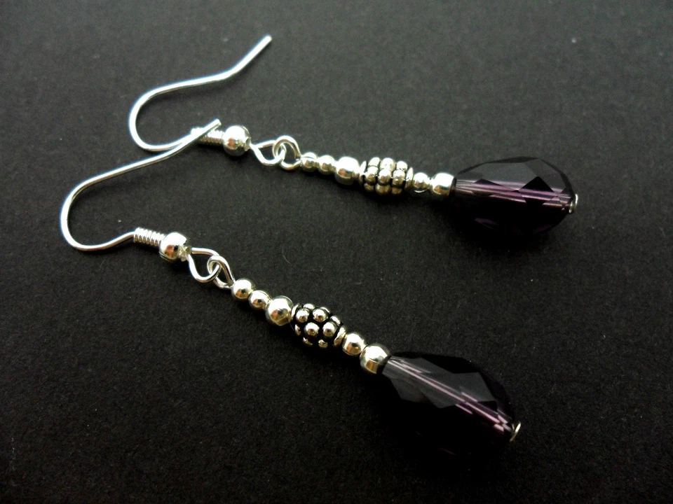 A PAIR OF DANGLY PURPLE GLASS CRYSTAL TEARDROP EARRINGS. NEW. - Image 1 of 1