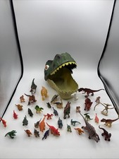 Mixed Dinosaur Toy Lot With Dinosaur Head Carrying Case