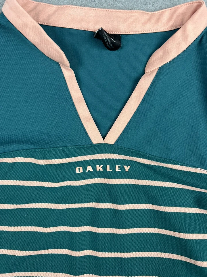 Camisa polo de golf Oakley para mujer mediana Bella azul verde azulado elástica deletreada Foto 2 de 4