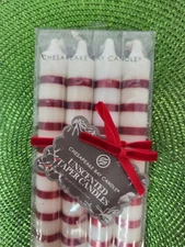 NIB Chesapeake Bay 4-pack of Unscented Taper White/Red Striped Candles.