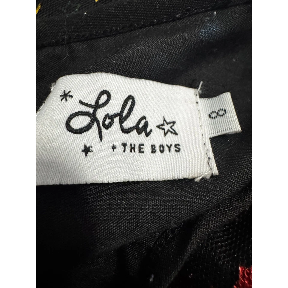 Vestido de fiesta LOLA + THE BOYS para niñas con lentejuelas fondo negro estrellas multicolores (8) Foto 3 de 4